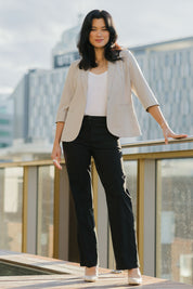 Model Miranda wearing size 10 of The Classic Tailored Stretch Pant in colour Black (Black), from the front, showing the whole outfit