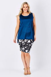 Model Jess wearing size 14 of The Tube Skirt in colour Floral (Black), from the front, showing the whole outfit