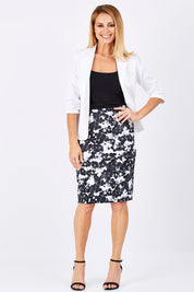 Model Monique wearing size 10 of The Tube Skirt in colour Floral (Black), from the front, showing the whole outfit