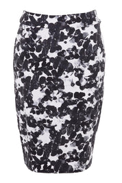 Product shot of The Tube Skirt in colour Floral (Black), from the front