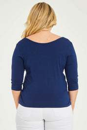 Model Katie wearing size 16 of The Reversible Cowl Neck Top in colour Deepnavy (Blue), from the back