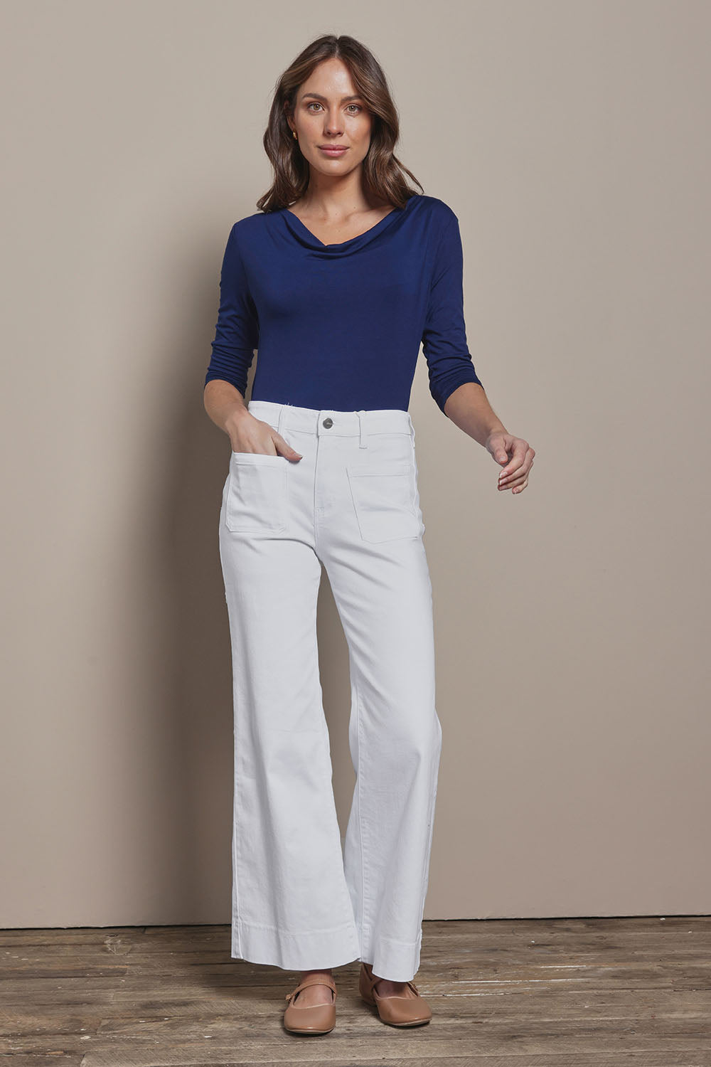 Model Madeline wearing size 10 of The Reversible Cowl Neck Top in colour Deepnavy (Blue), from the front, showing the whole outfit