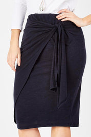 Model Laura wearing size 12 of the Belle Tie Front Skirt in colour Navy (Blue), from the front, cropped image