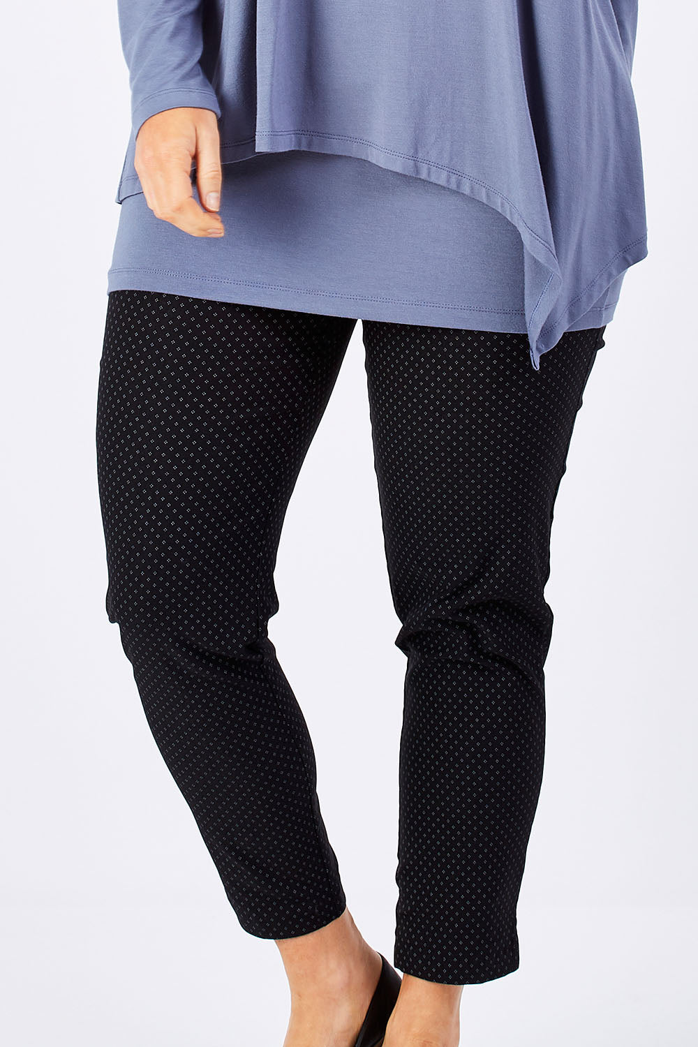 Model Laura wearing size 12 of the Belle Print Bengalene Pant in colour BlackPrint (Black), from the front, cropped image
