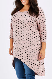 Model Mae wearing size 18 of the Belle Spot Print Tunic in colour PinkSpot (Pink), from the front, cropped image
