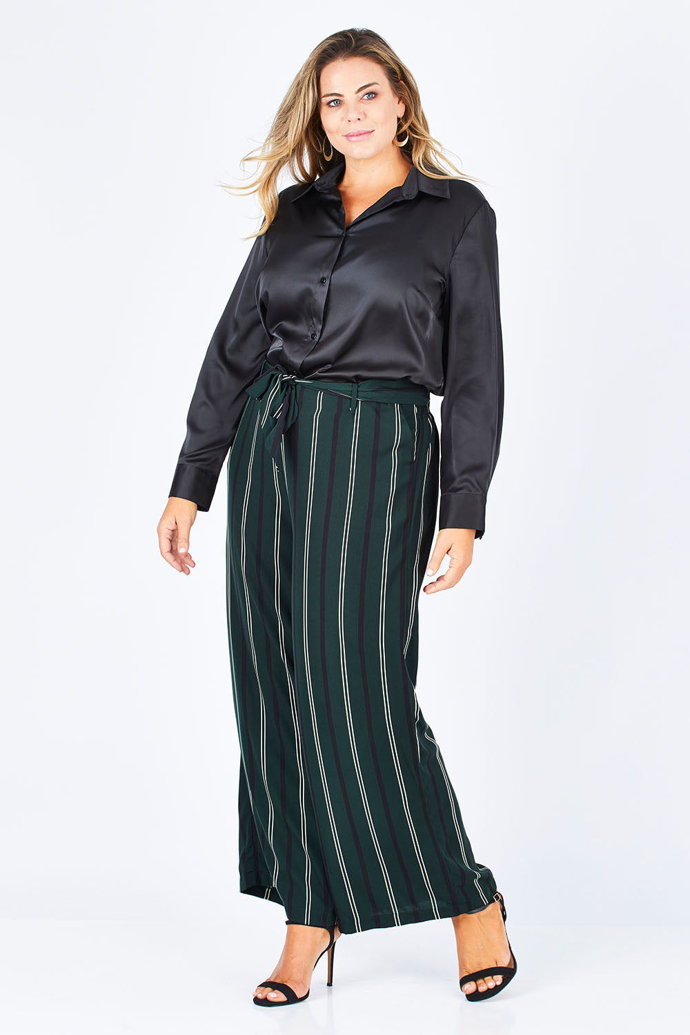 Model Fiona wearing size 16 of the Belle Wide Stripe Pant in colour GreenStrip (Green), from the front, showing the whole outfit