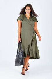 Model Lauren wearing size 16 of the Belle Ruffle Trim Dress in colour Khaki (Green), from the front, showing the whole outfit