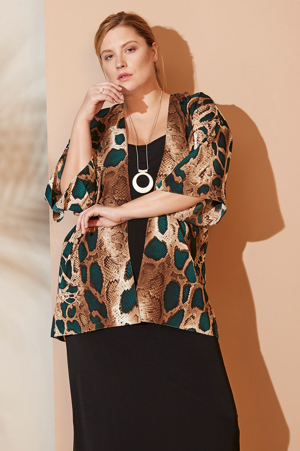 Model Mercy wearing size 12 of the Belle Python Print Kimono Jacket in colour Pythprin (Black), from the front, showing the whole outfit