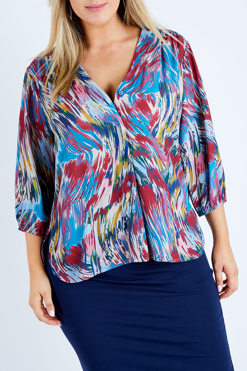 Model Jess wearing size 12 of the Belle Swirl Print Top in colour Swirlprint (Blue), from the front, cropped image