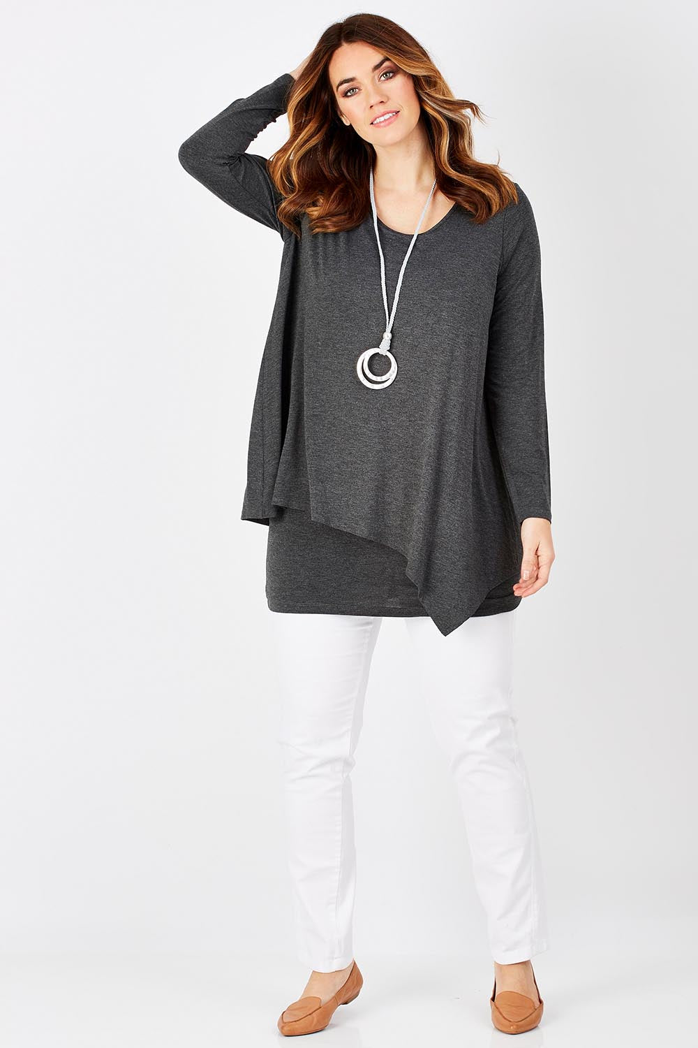Model Laura wearing size 12 of the Belle Forgiver Tunic in colour Charcoal (Grey), from the front, showing the whole outfit