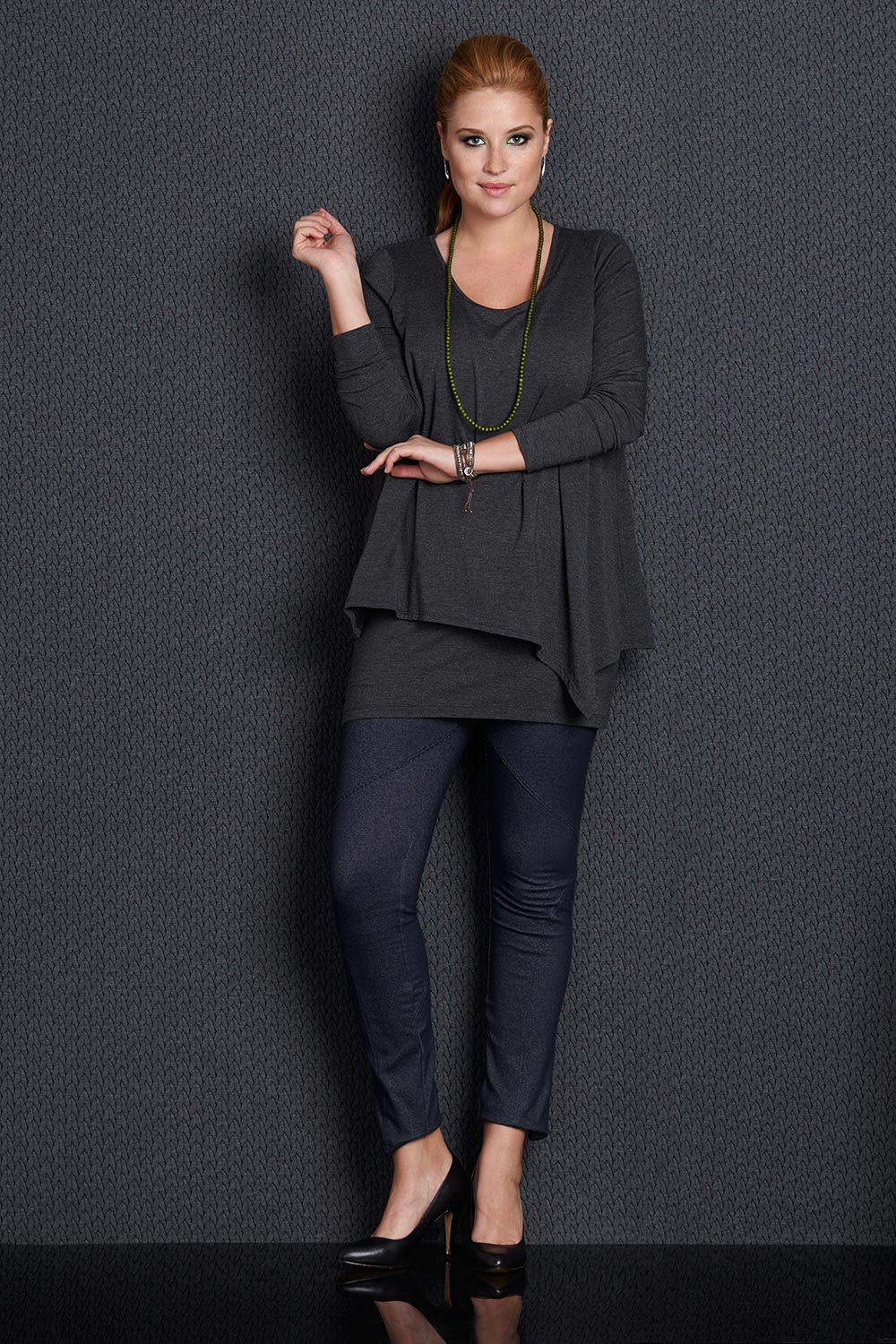 Model Mercy wearing size 14 of the Belle Forgiver Tunic in colour Charcoal (Grey), from the front, showing the whole outfit