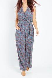 Model Laura wearing size 12 of the Belle Ditsy Floral Jumpsuit in colour Ditsyflora (Blue), from the front, cropped image