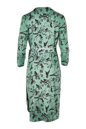 Product shot of the Belle Bird Print Wrap Dress in colour Bird (Green), from the back