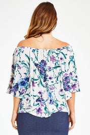 Model Laura wearing size 12 of the Belle Lavender Floral Top in colour Lavender (Purple), from the back