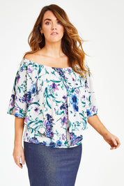 Model Laura wearing size 12 of the Belle Lavender Floral Top in colour Lavender (Purple), from the front, cropped image