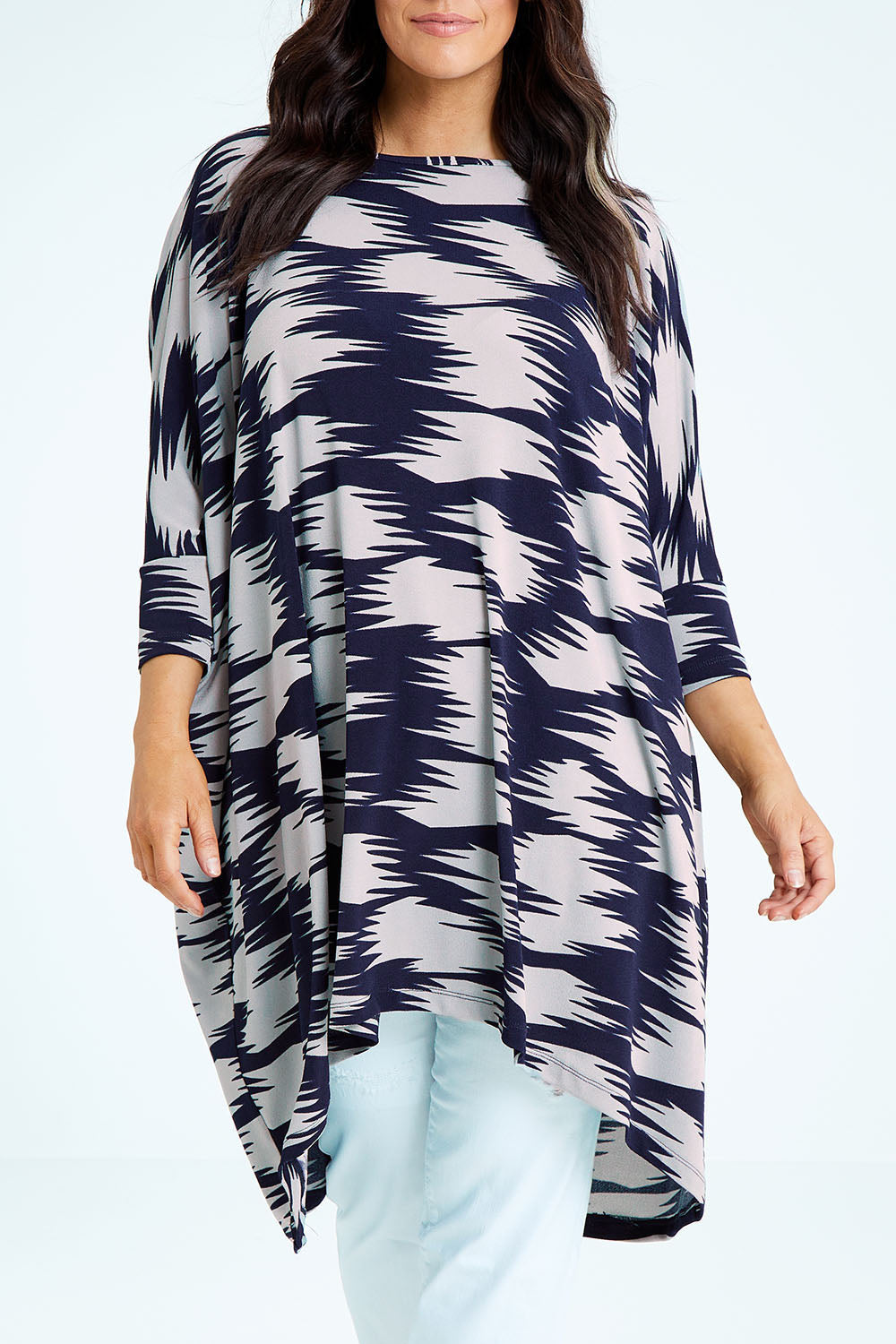 Model Laura wearing size M of the Belle Printed Throw Over in colour Strokes (Blue), from the front, cropped image