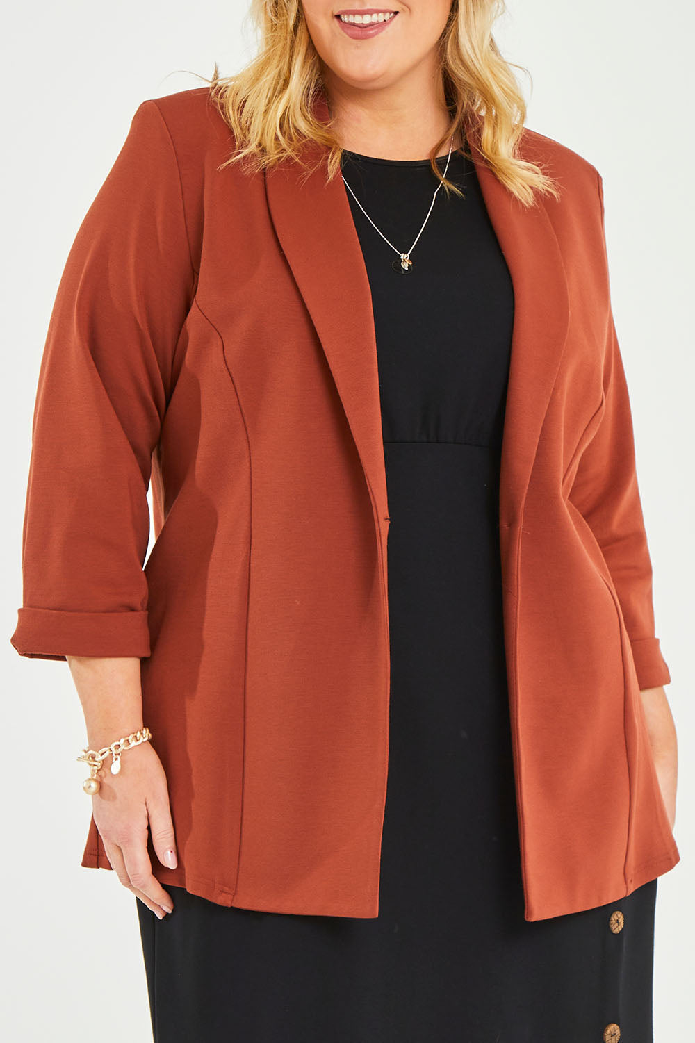 Model Caitlin wearing size 20 of the Belle Long Line Ponte Jacket in colour Ochre, from the front, cropped image