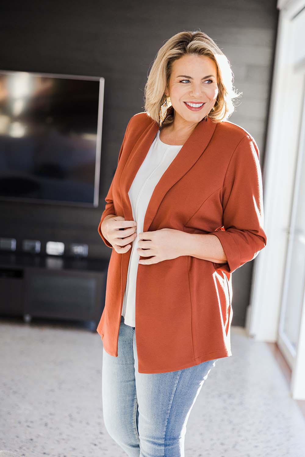 Model Fiona wearing size 16 of the Belle Long Line Ponte Jacket in colour Ochre, from the front, showing the whole outfit