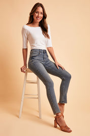 Model Madeline wearing size 10 of the Belle Boot Leg Jean in colour Mediumblue (Blue), from the front, showing the whole outfit