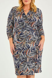 Model Caitlin wearing size 20 of the Belle Classic Lined Wrap Jersey Dress in colour Navyprint (Blue), from the front, cropped image