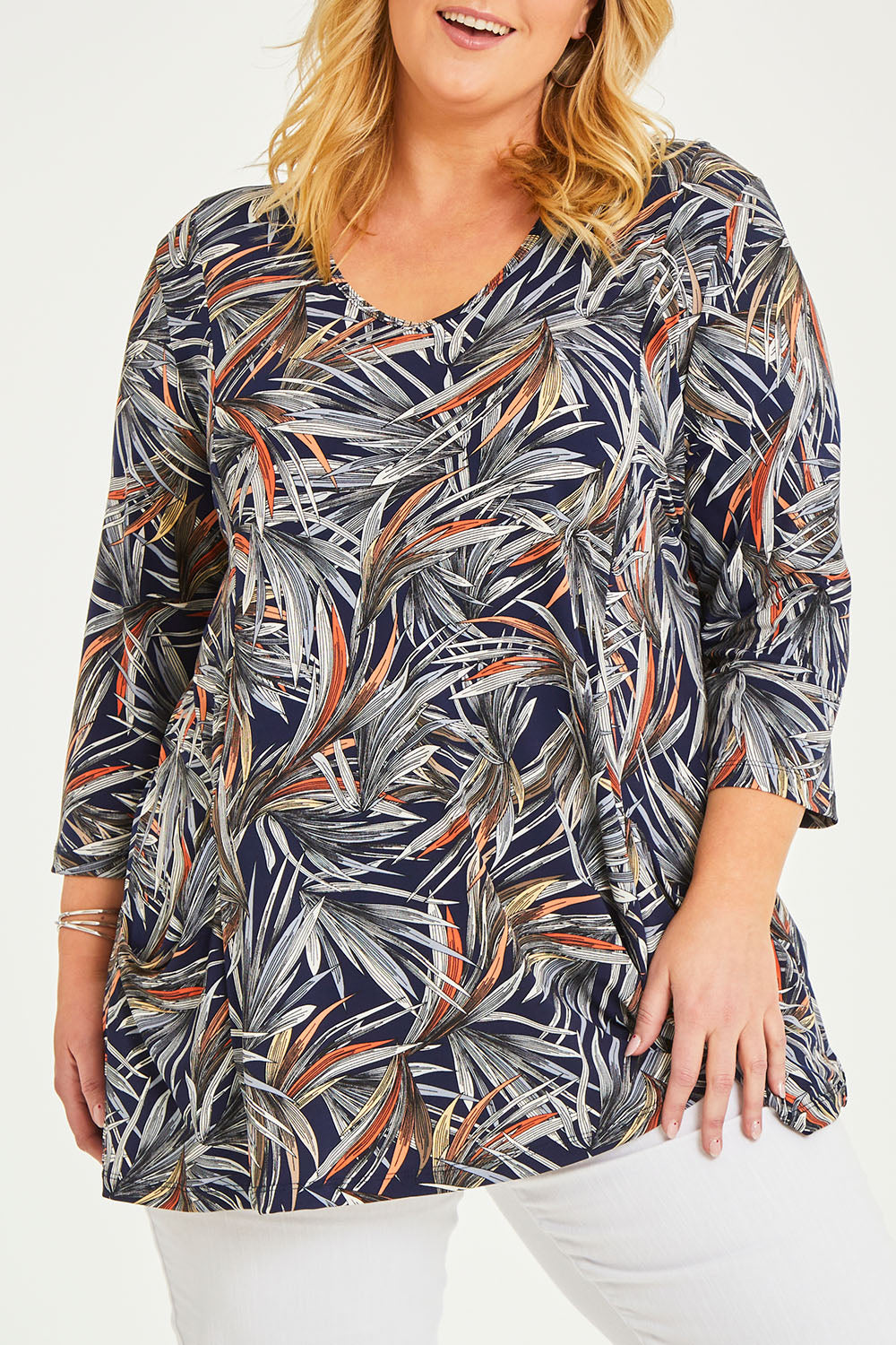 Model Caitlin wearing size 20 of the Belle Jersey Tee With Pocket Detail in colour Navyprint (Blue), from the front, cropped image