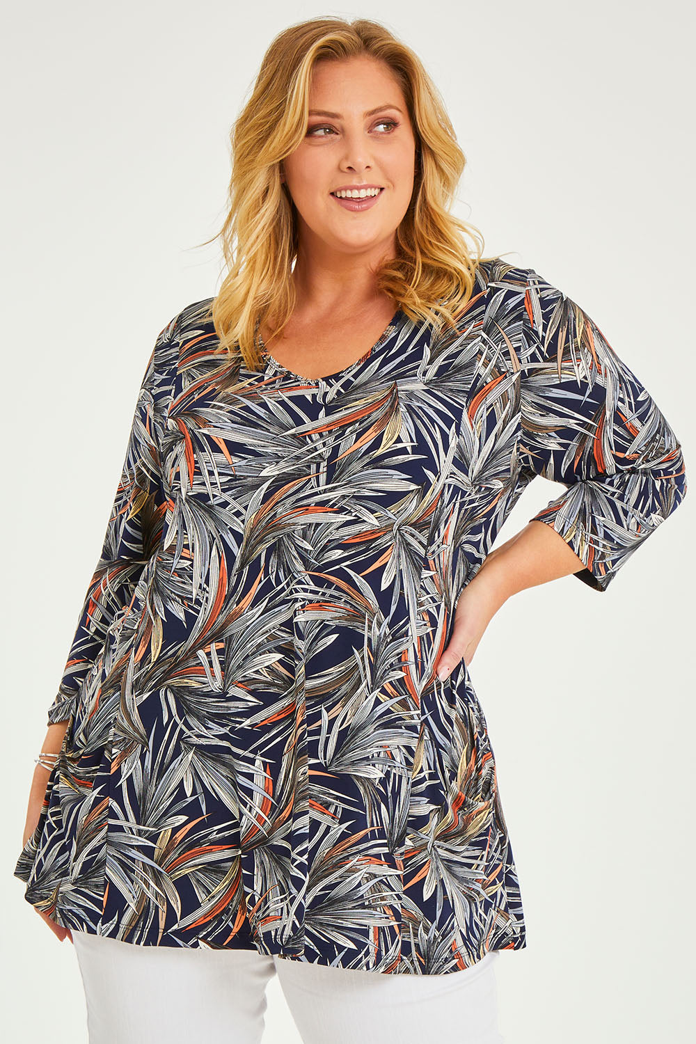 Model Caitlin wearing size 20 of the Belle Jersey Tee With Pocket Detail in colour Navyprint (Blue), from the front, cropped image