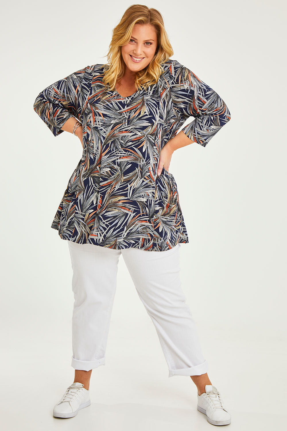 Model Caitlin wearing size 20 of the Belle Jersey Tee With Pocket Detail in colour Navyprint (Blue), from the front, showing the whole outfit