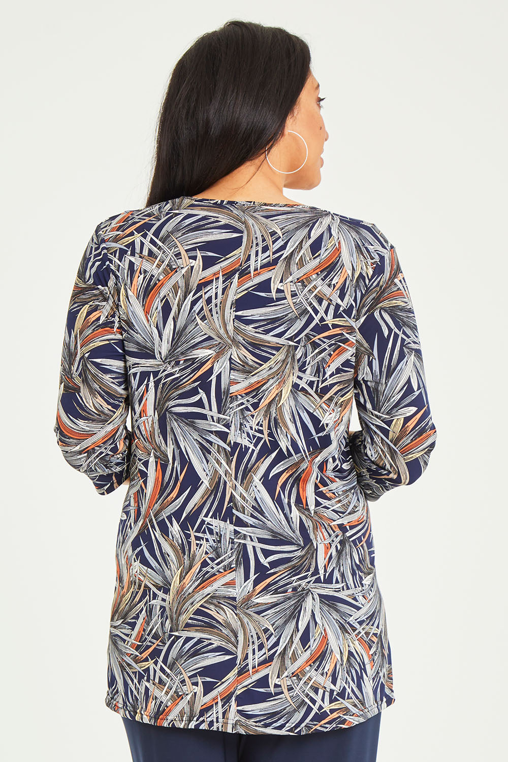 Model Terri-Leigh wearing size 14 of the Belle Jersey Tee With Pocket Detail in colour Navyprint (Blue), from the back
