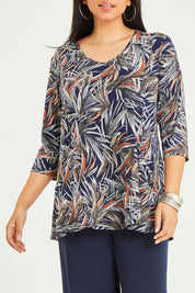 Model Terri-Leigh wearing size 14 of the Belle Jersey Tee With Pocket Detail in colour Navyprint (Blue), from the front, cropped image