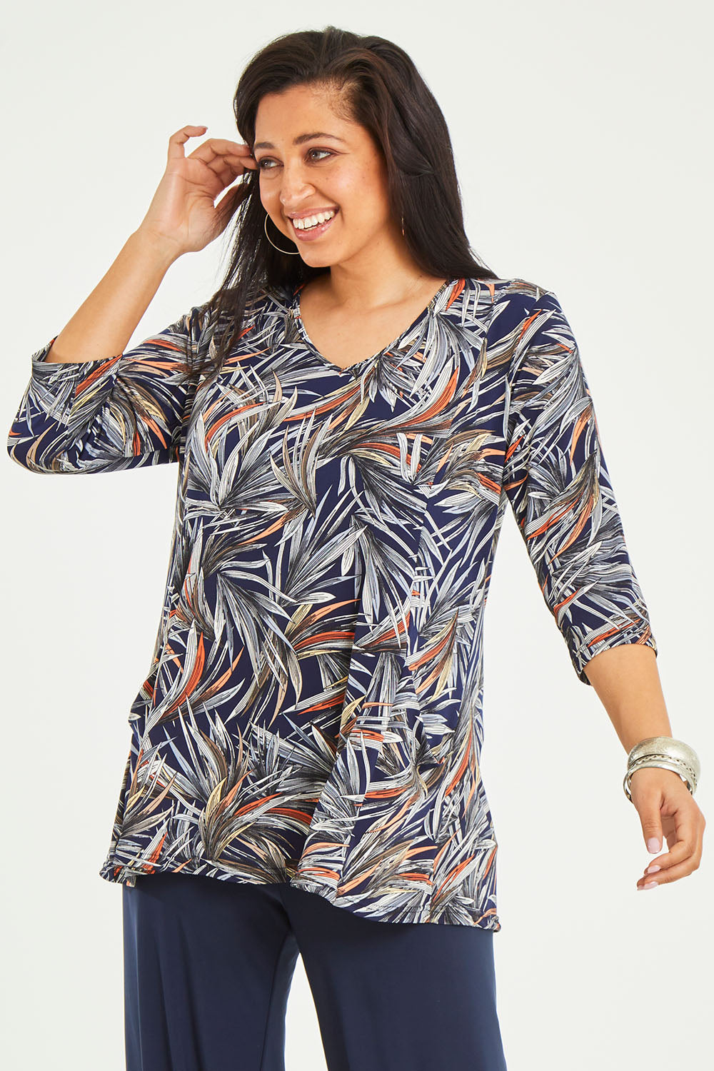 Model Terri-Leigh wearing size 14 of the Belle Jersey Tee With Pocket Detail in colour Navyprint (Blue), from the front, cropped image