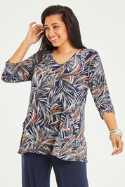 Model Terri-Leigh wearing size 14 of the Belle Jersey Tee With Pocket Detail in colour Navyprint (Blue), from the front, cropped image
