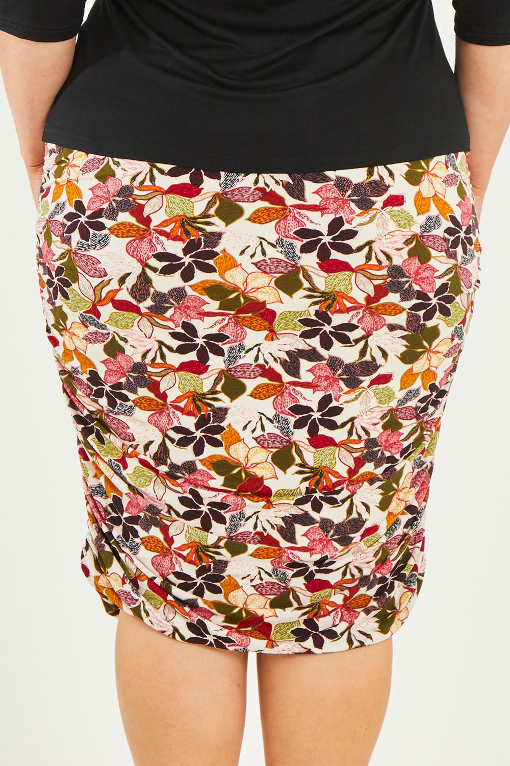 Model Caitlin wearing size 20 of the Belle Lined Side Gathered Skirt in colour Floral (White), from the back