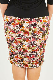 Model Caitlin wearing size 20 of the Belle Lined Side Gathered Skirt in colour Floral (White), from the back