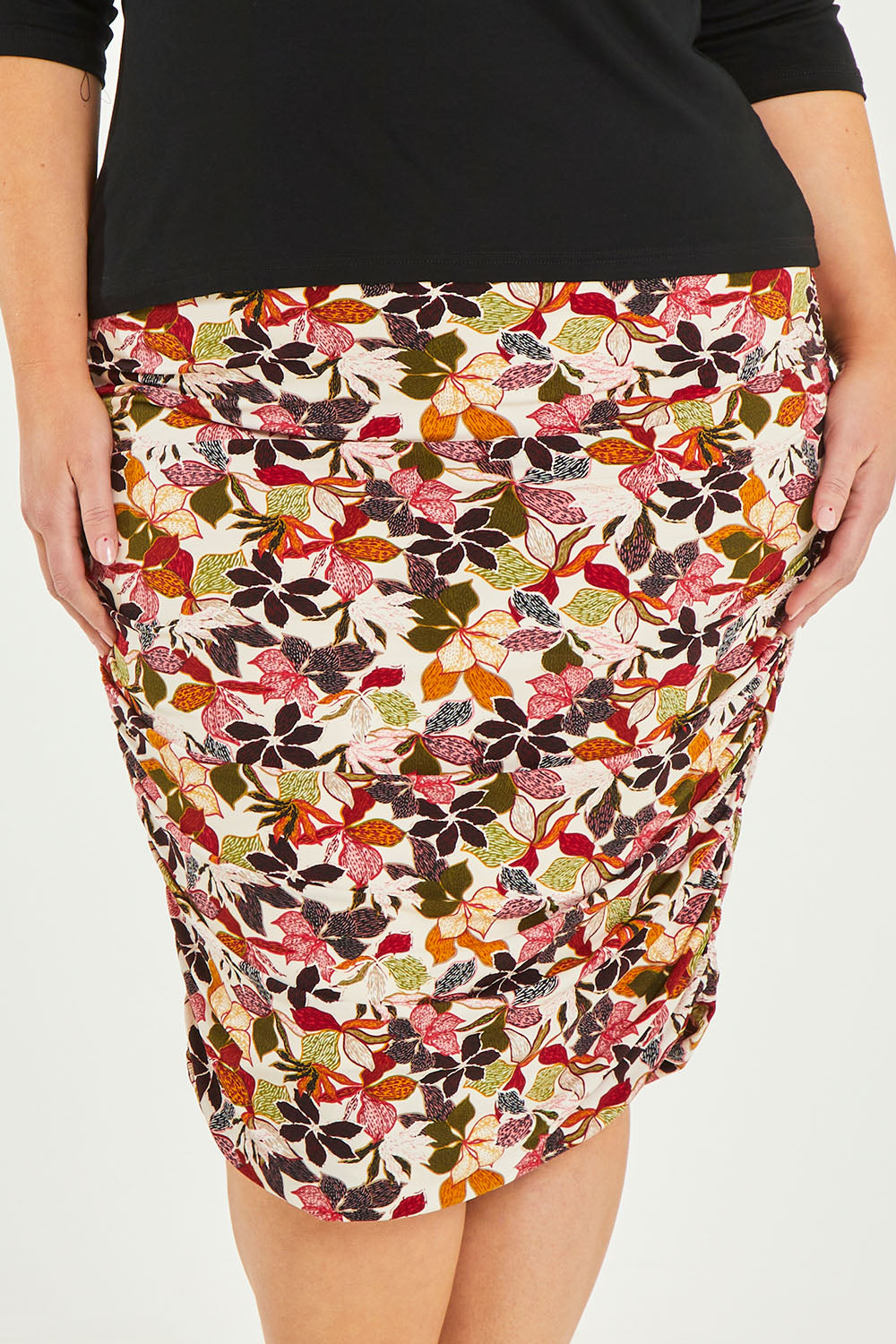 Model Caitlin wearing size 20 of the Belle Lined Side Gathered Skirt in colour Floral (White), from the front, cropped image