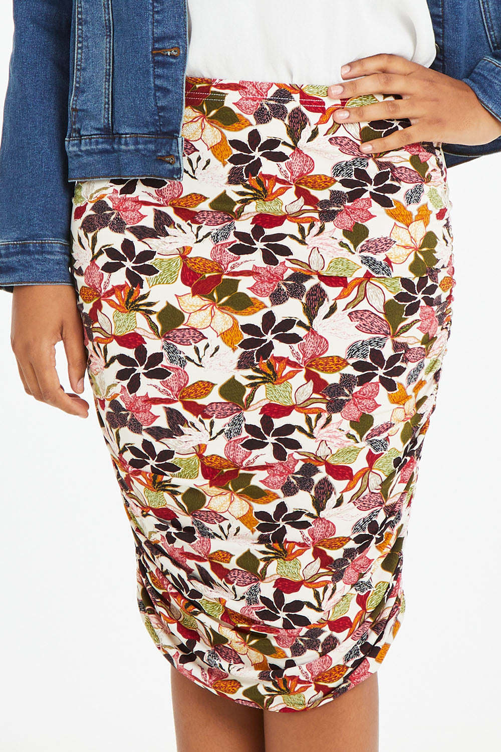 Model Noli wearing size 14 of the Belle Lined Side Gathered Skirt in colour Floral (White), from the front, cropped image