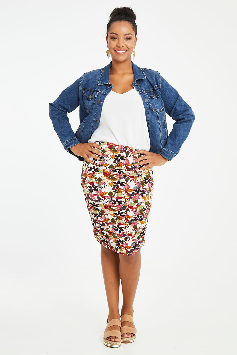 Model Noli wearing size 14 of the Belle Lined Side Gathered Skirt in colour Floral (White), from the front, showing the whole outfit