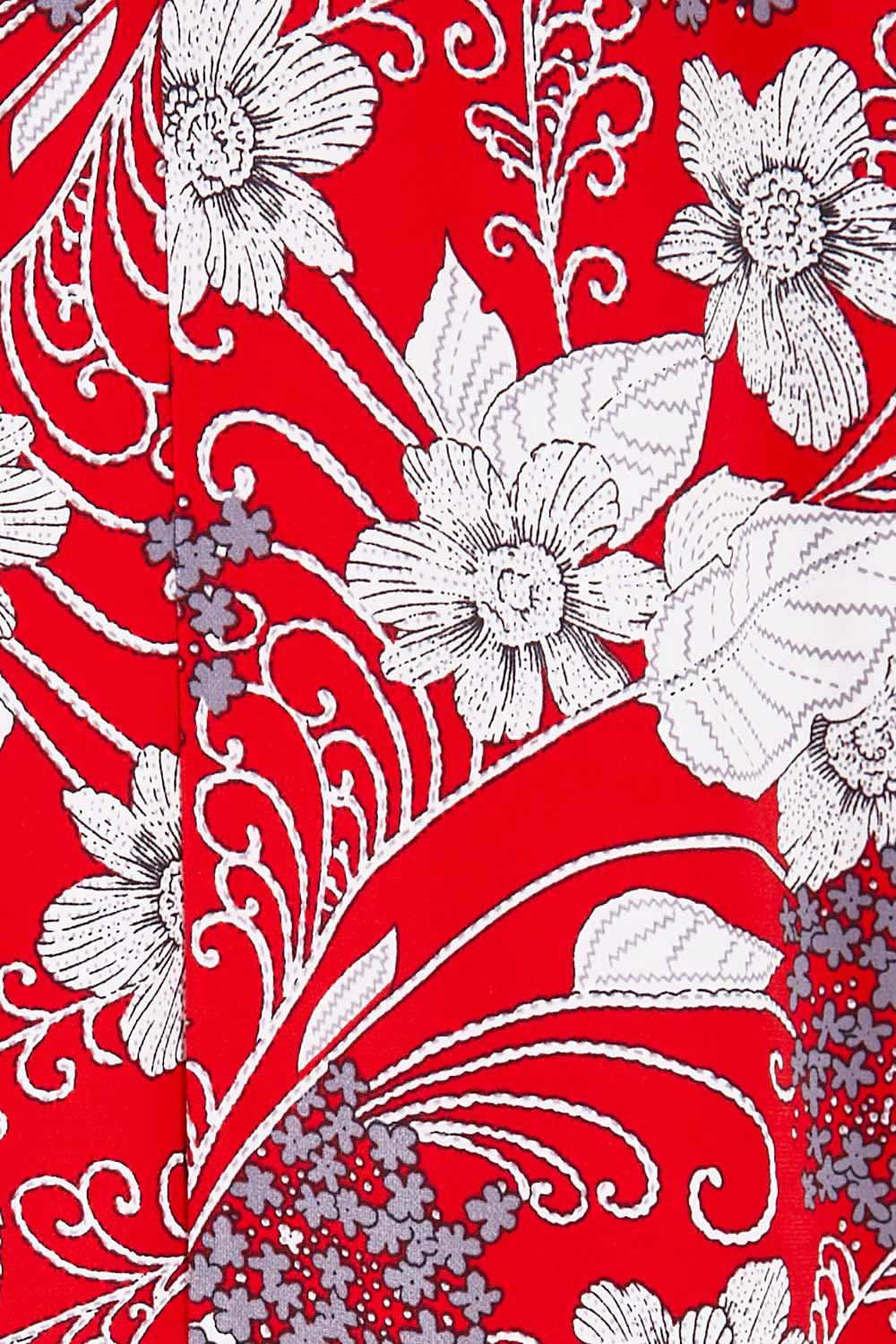 Product shot of the Belle High Low Dress With Pockets in colour Redfloral (Red), detail