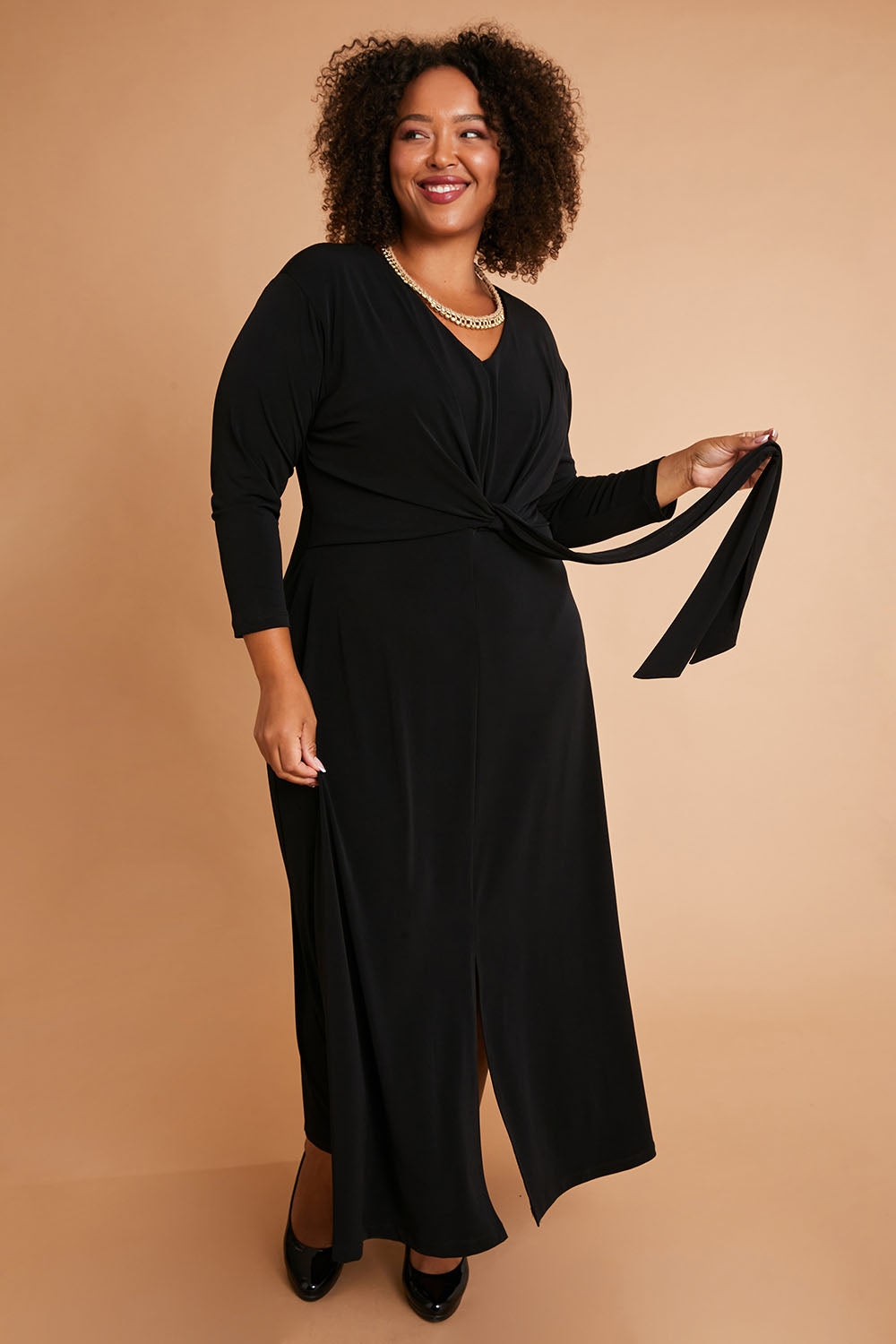 Model Alexis wearing size 16 of the Belle Must Have Maxi Dress in colour Black (Black), from the front, showing the whole outfit