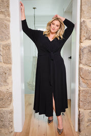 Model Caitlin wearing size 18 of the Belle Must Have Maxi Dress in colour Black (Black), from the front, showing the whole outfit