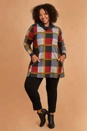 Model Alexis wearing size 16 of the Belle Roll Neck Tunic in colour Multiprint (Grey), from the front, showing the whole outfit