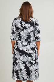 Model Monique wearing size 14 of the Belle Classic Full Skirt Dress in colour Blackgrey (Black), from the back