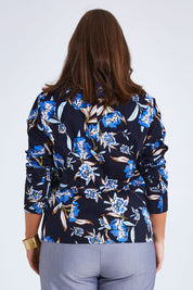 Model Monique wearing size 14 of the Belle Stretch Printed Blazer in colour Bluefloral (Blue), from the back