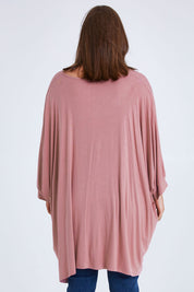Model Monique wearing size 14 of the Belle Goddess Cotton Tee in colour Blush (Pink), from the back
