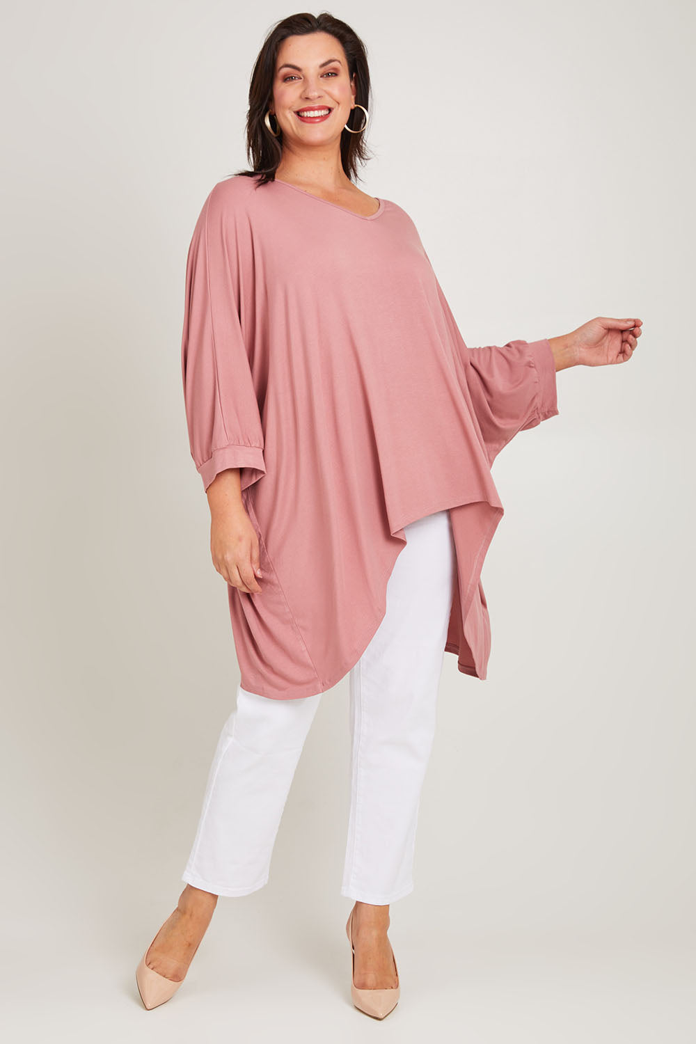 Model Poppy wearing size 16 of the Belle Goddess Cotton Tee in colour Blush (Pink), from the front, showing the whole outfit