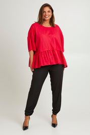 Model Monique wearing size 14 of the Belle Layered Cotton Linen Kaftan Top in colour Lipstick (Red), from the front, showing the whole outfit