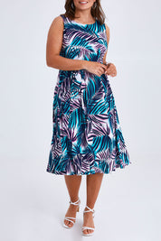 Model Monique wearing size 14 of the Belle Sleeveless Full Skirt Dress in colour Palmprint (Blue), from the front, cropped image