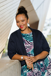 Model Alexis wearing size 18 of the Belle Cotton Sateen Cropped Jacket in colour Navy (Blue), from the front, showing the whole outfit