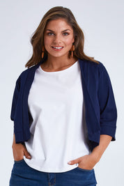 Model Monique wearing size 14 of the Belle Cotton Sateen Cropped Jacket in colour Navy (Blue), from the front, cropped image