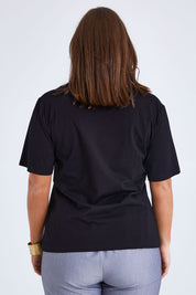Model Monique wearing size 14 of the Belle Lace Insert Tee in colour Black (Black), from the back
