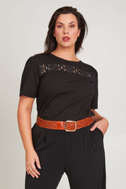 Model Poppy wearing size 16 of the Belle Lace Insert Tee in colour Black (Black), from the front, cropped image